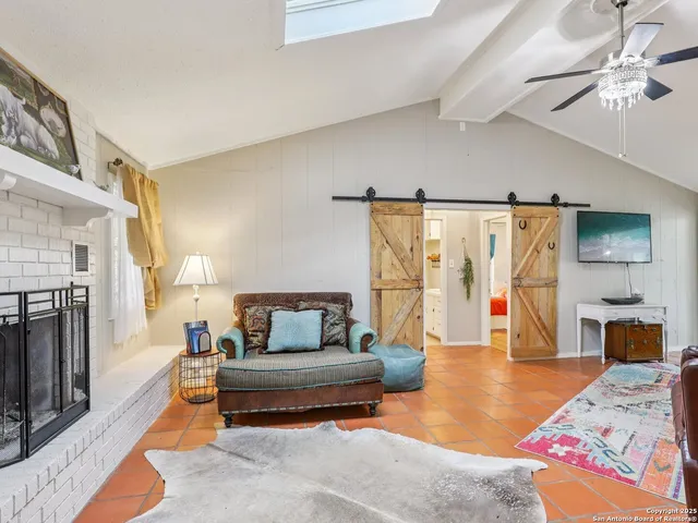 a bedroom with furniture and a fireplace