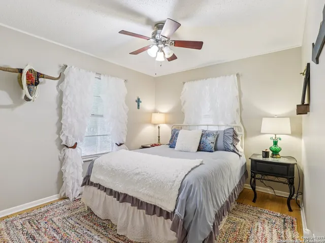 a bedroom with a bed and a table