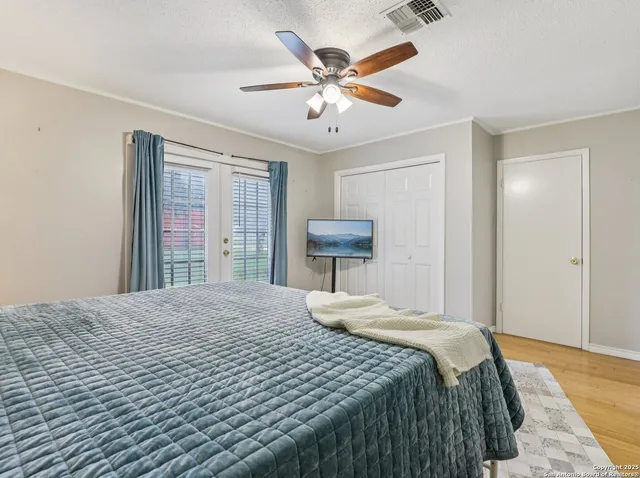 a bedroom with a bed and window