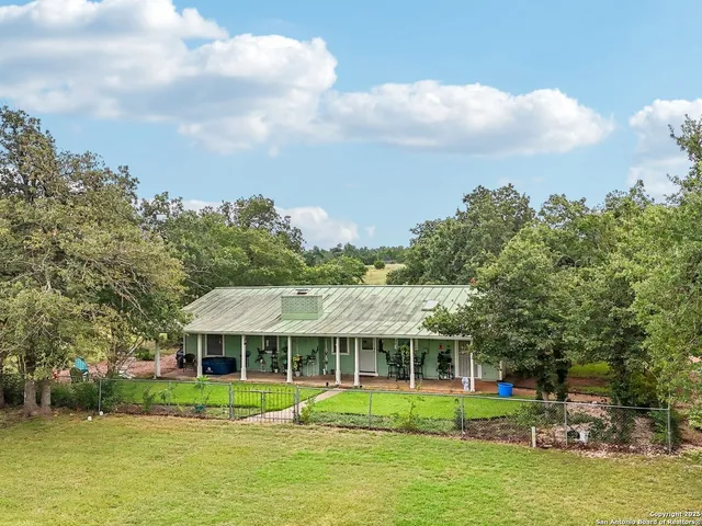 a view of a lake with houses in the back