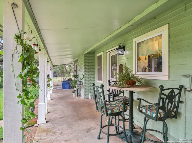a view of an outdoor dining space with seating area