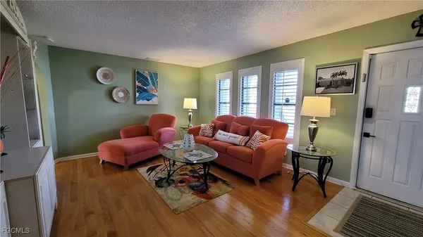 a living room with furniture and a table