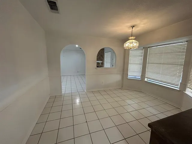 a view of a kitchen with a sink and a microwave