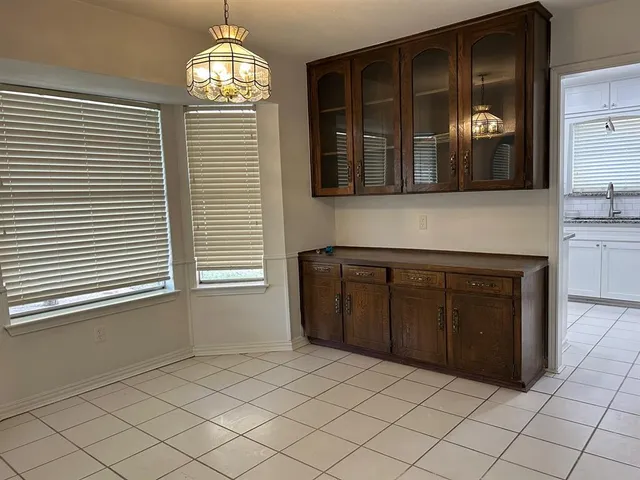 a kitchen with a cabinets and a stove top oven