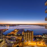 an aerial view of multiple houses with a yard