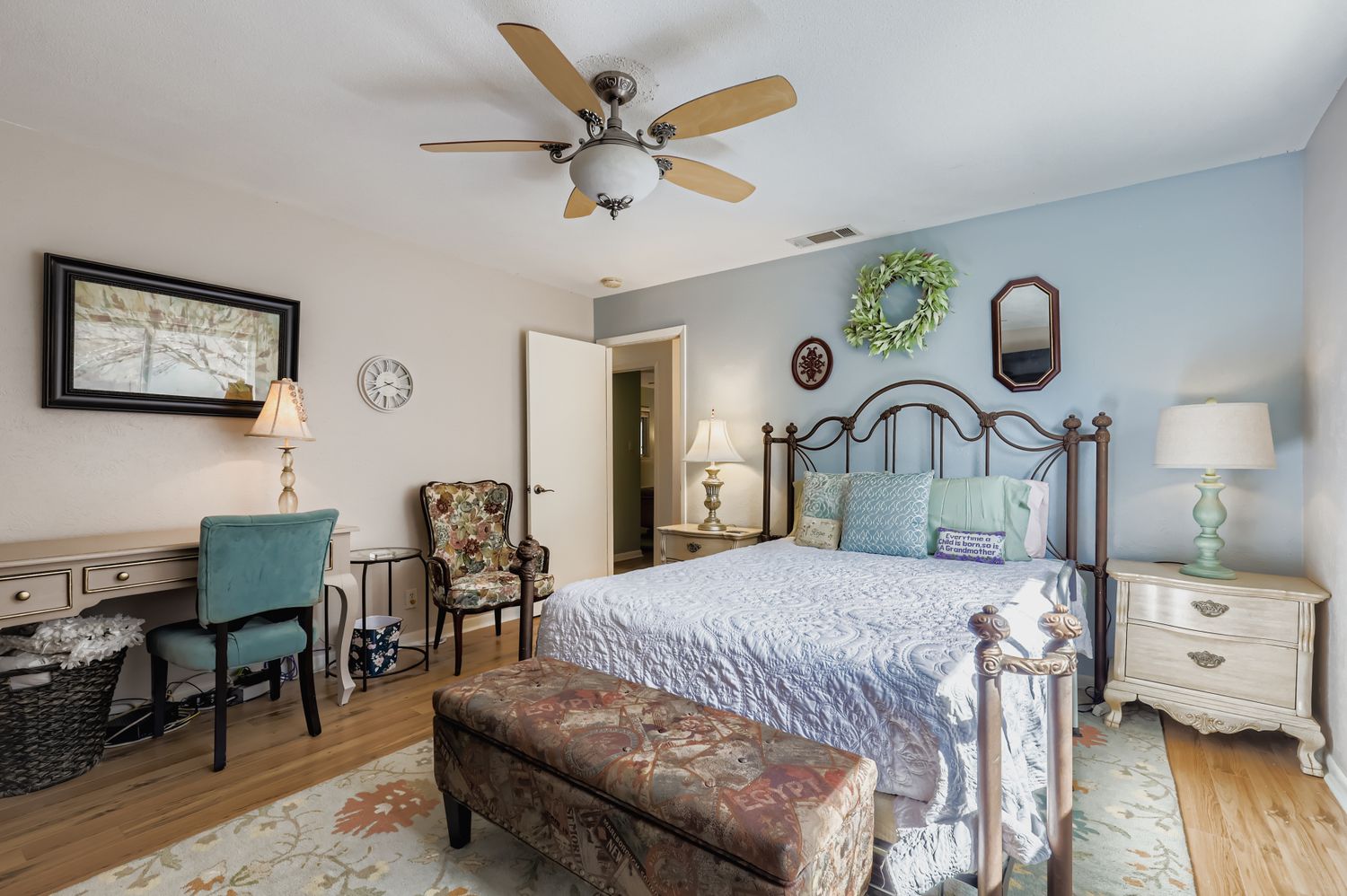 11718 Running Fox Trail Austin, TX 78759 - Photo 18 of 30 a bedroom with a bed and wooden floor