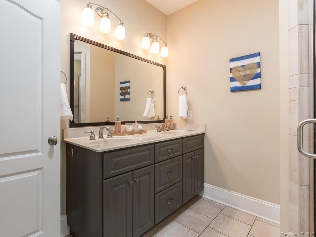 919 Millbrook Road Charlotte, NC 28211 - Photo 12 of 20 a bathroom with a granite countertop sink and a mirror