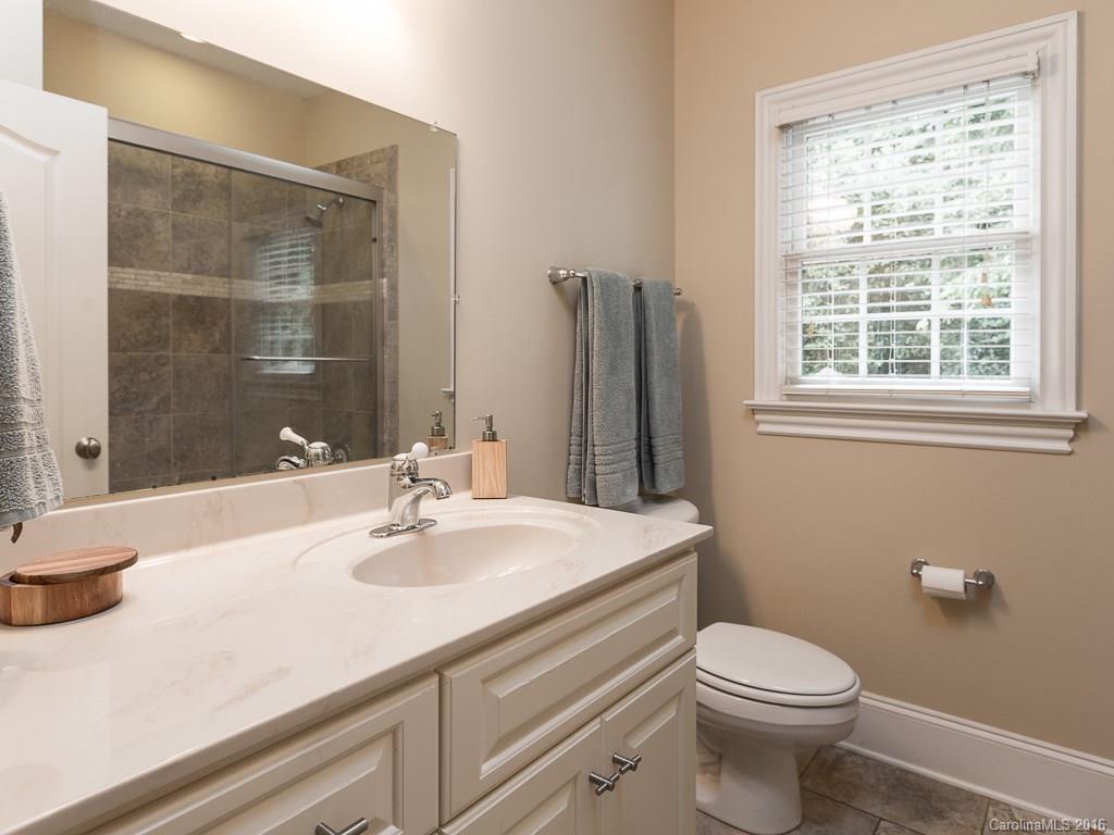 919 Millbrook Road Charlotte, NC 28211 - Photo 14 of 20 a bathroom with a sink a toilet and shower