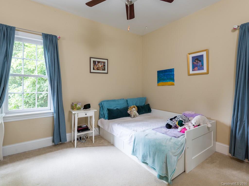 919 Millbrook Road Charlotte, NC 28211 - Photo 15 of 20 a bedroom with a bed and a window