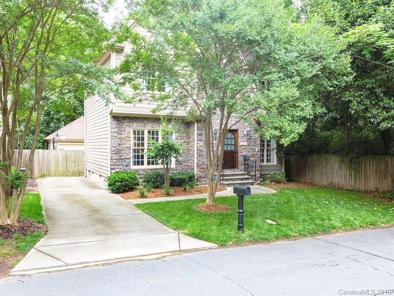 919 Millbrook Road Charlotte, NC 28211 - Photo 19 of 20 a front view of a house with a yard and table and chairs
