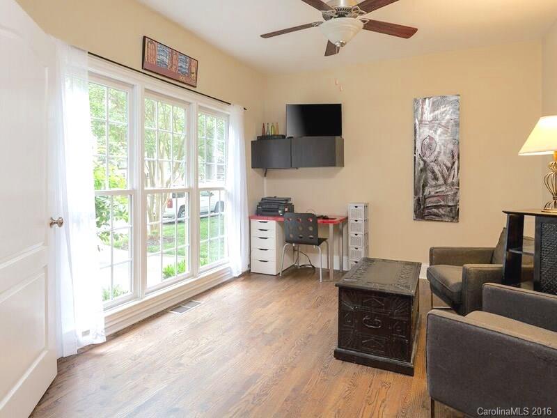 919 Millbrook Road Charlotte, NC 28211 - Photo 8 of 20 a living room with furniture and a floor to ceiling window