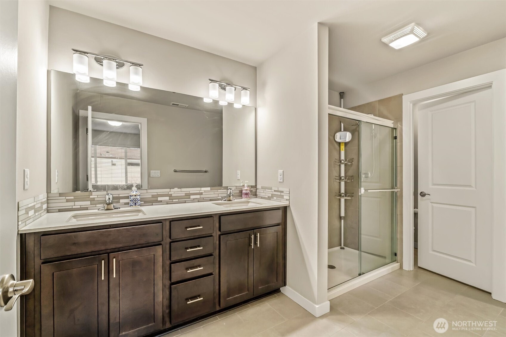 19326 37th Avenue Southeast, Unit C Bothell, WA 98012 - Photo 14 of 32 a bathroom with a double vanity sink mirror and double