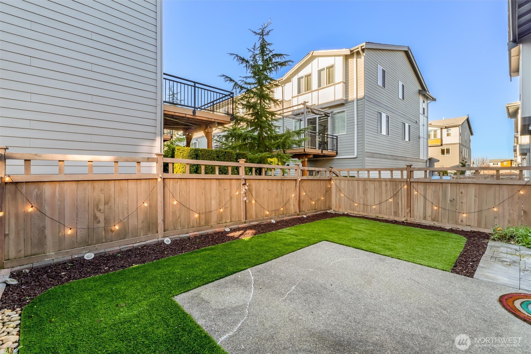 19326 37th Avenue Southeast, Unit C Bothell, WA 98012 - Photo 21 of 32 a view of a back yard of the house with a yard