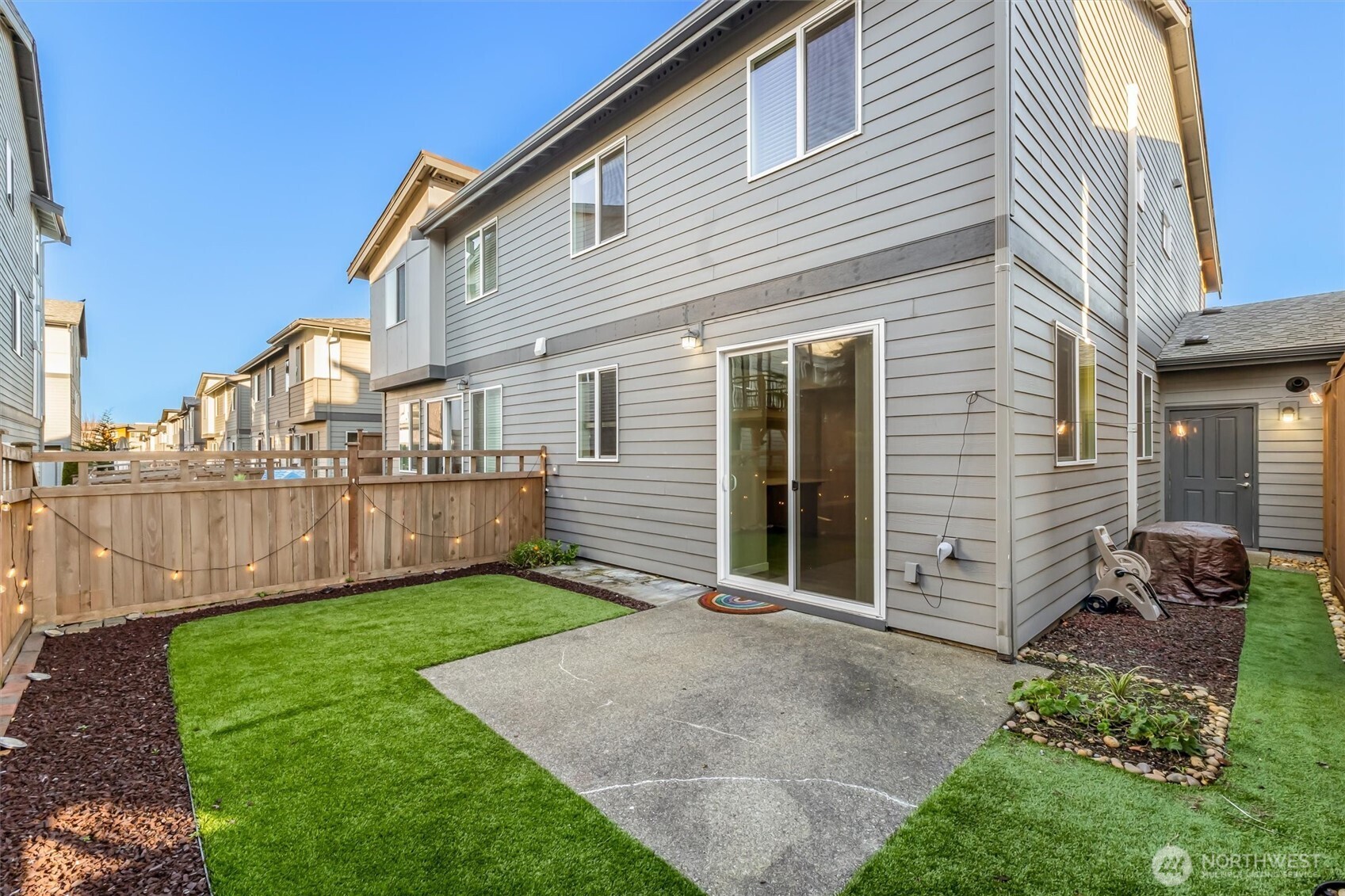 19326 37th Avenue Southeast, Unit C Bothell, WA 98012 - Photo 22 of 32 a view of a house with backyard and porch