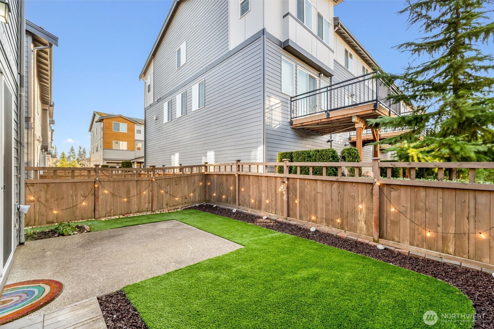 19326 37th Avenue Southeast, Unit C Bothell, WA 98012 - Photo 24 of 32 a view of a backyard with wooden fence