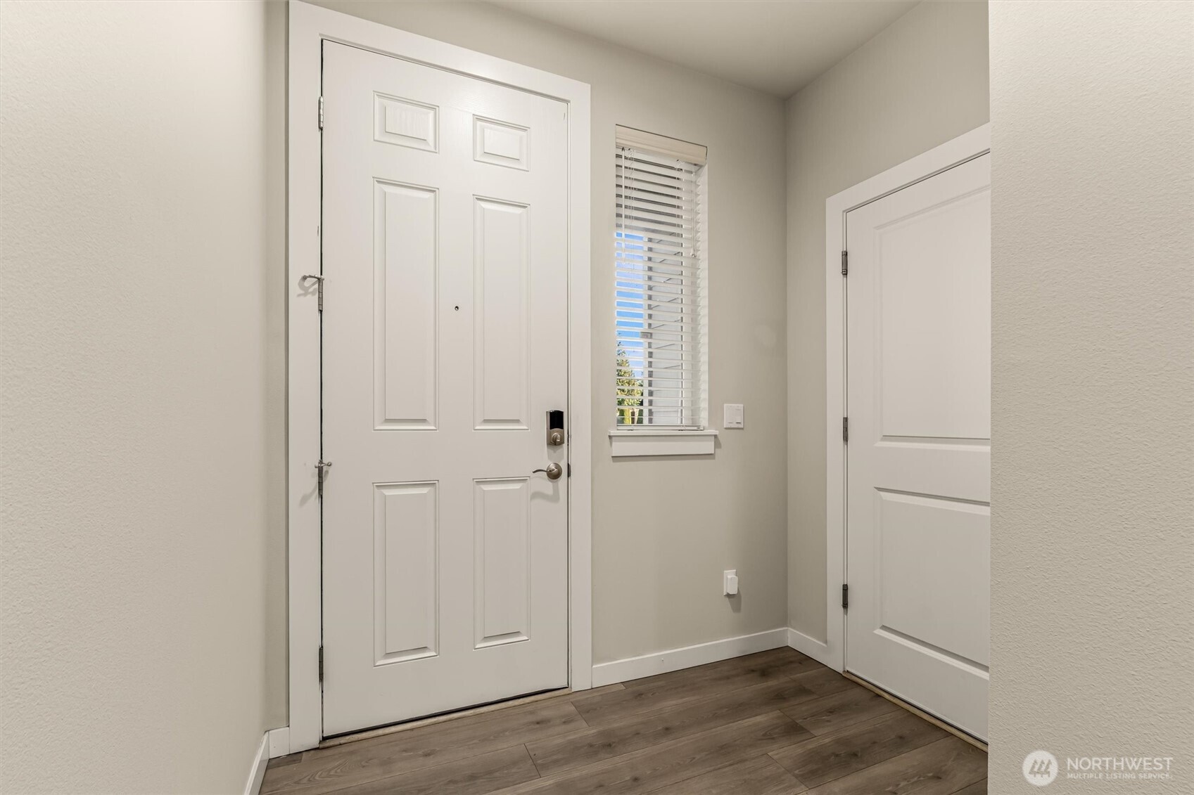 19326 37th Avenue Southeast, Unit C Bothell, WA 98012 - Photo 3 of 32 an empty room with wooden floor