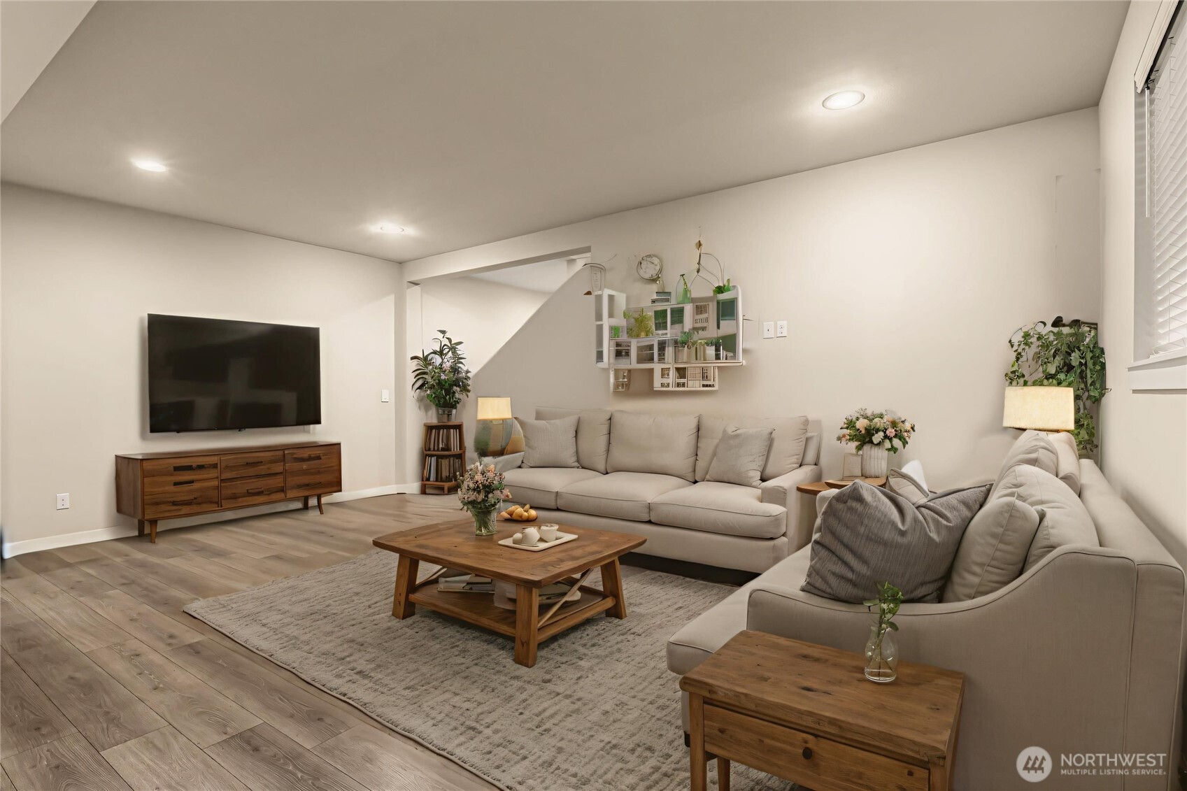 19326 37th Avenue Southeast, Unit C Bothell, WA 98012 - Photo 5 of 32 a living room with furniture and a flat screen tv