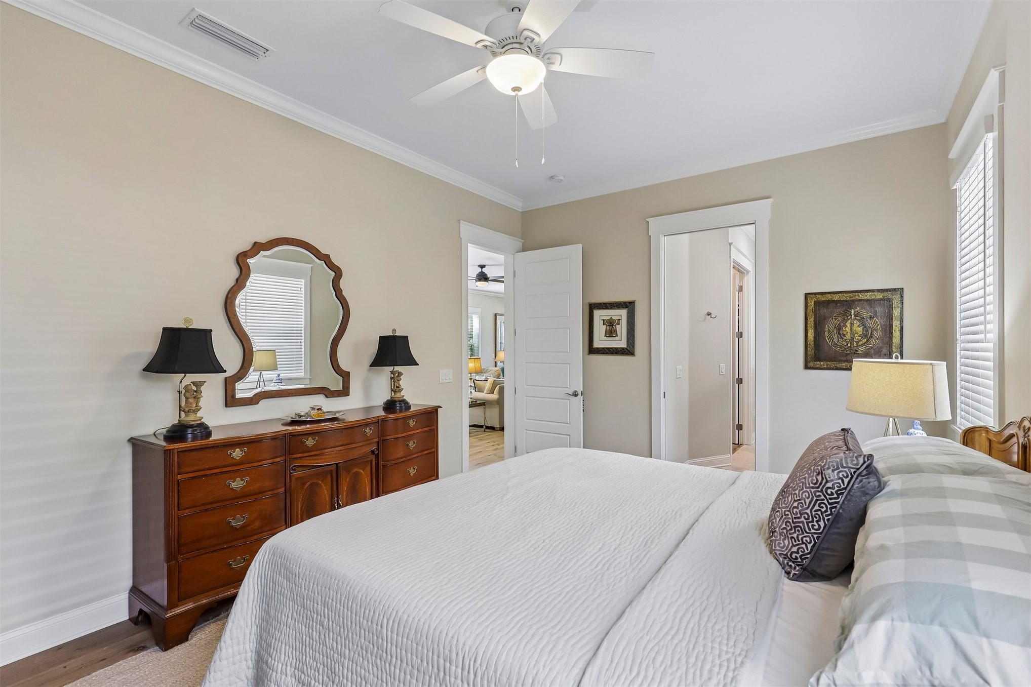 1012 White Street Fernandina Beach, FL 32034 - Photo 22 of 35 a bedroom with a bed and a dresser with mirror