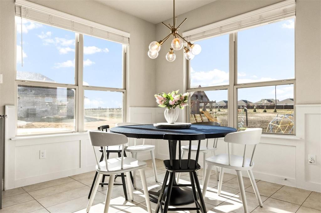 1133 Barrix Drive Forney, TX 75126 - Photo 13 of 35 a dining room filled with furniture and window