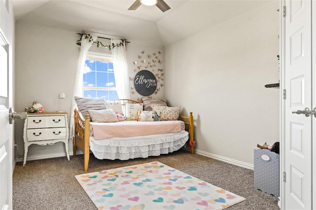 1133 Barrix Drive Forney, TX 75126 - Photo 20 of 35 a bedroom with furniture and a large window