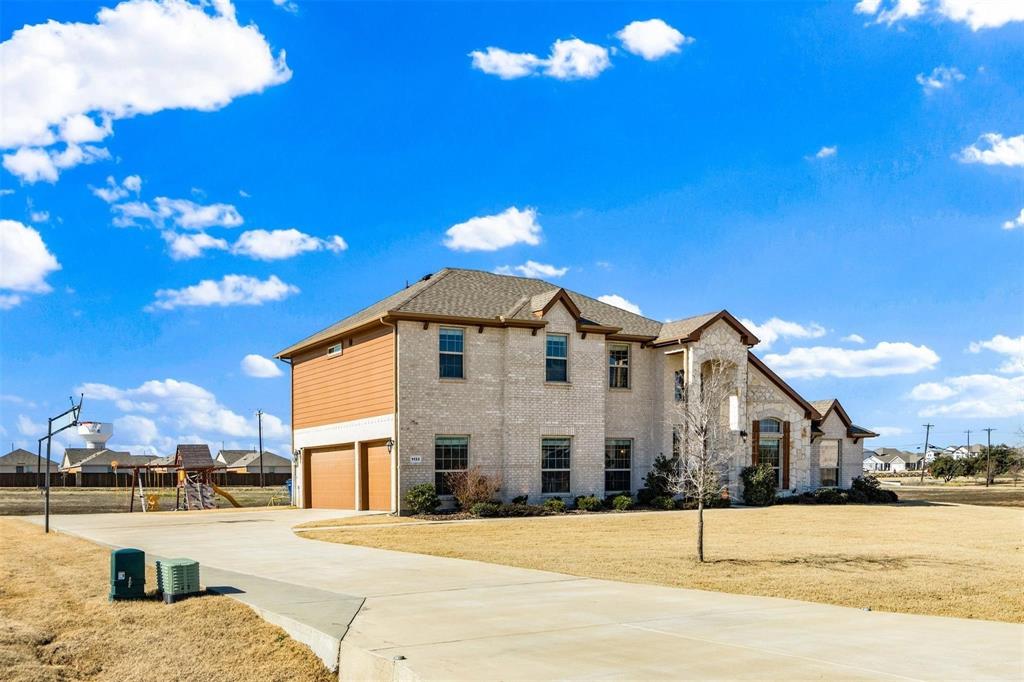 1133 Barrix Drive Forney, TX 75126 - Photo 26 of 35 a front view of a house with a yard