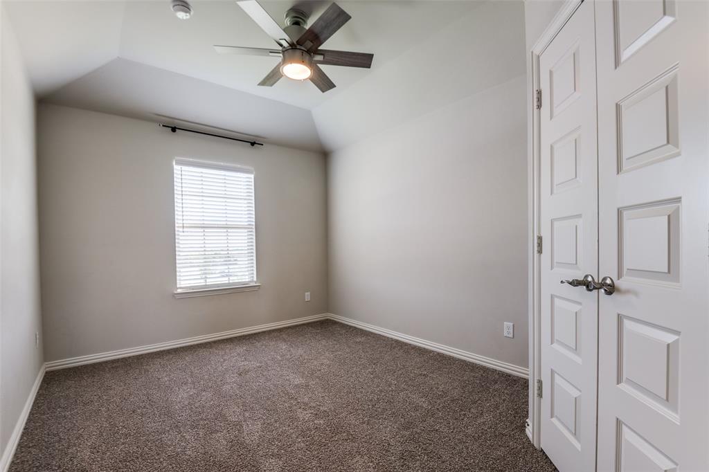 1133 Barrix Drive Forney, TX 75126 - Photo 33 of 35 an empty room with a window and a fan