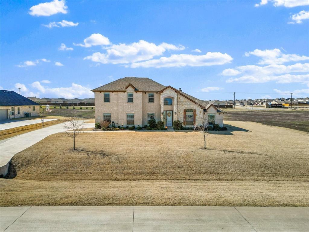 1133 Barrix Drive Forney, TX 75126 - Photo 6 of 35 a view of a houses with a yard