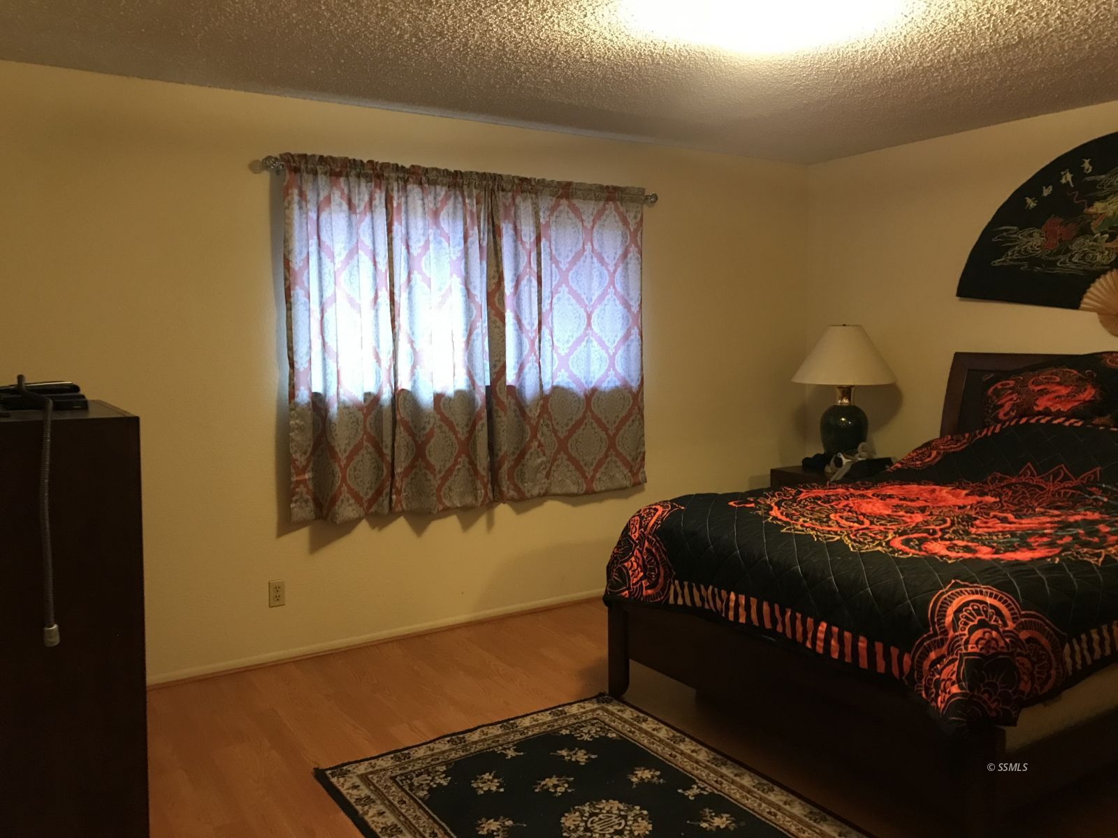 232 Apache Lane Ridgecrest, CA 93555 - Photo 13 of 19 a bedroom with a bed and a window