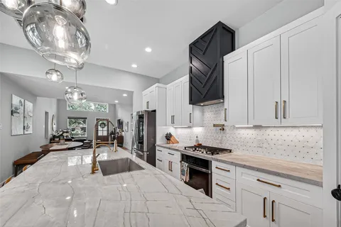a kitchen with a sink and cabinets
