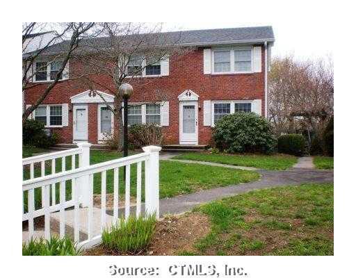 25 Riverside Drive, Unit E1 Hamden, CT 06518 - Photo 1 of 1 a front view of a house with a yard