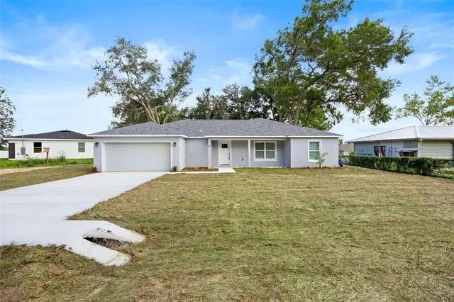 a house with swimming pool in front of it