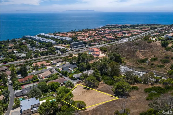 an aerial view of residential building and ocean