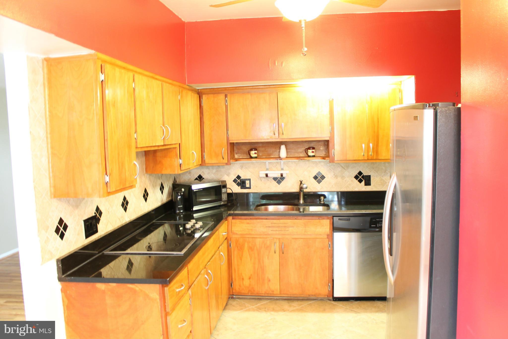 4720 Old Court Road Baltimore, MD 21208 - Photo 6 of 21 Kitchen with lots of cabinets space and granite