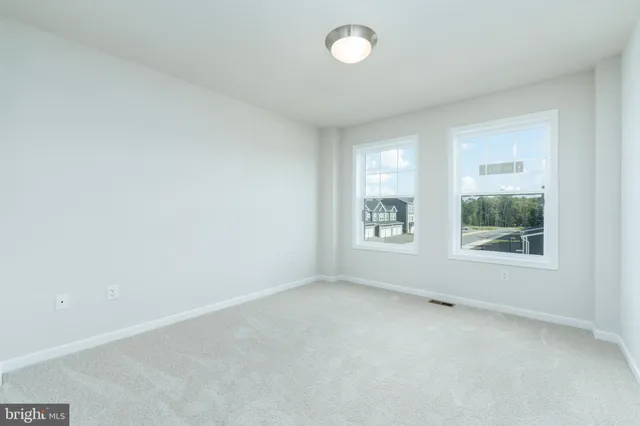 a bathroom with a granite countertop toilet a sink and a bathtub