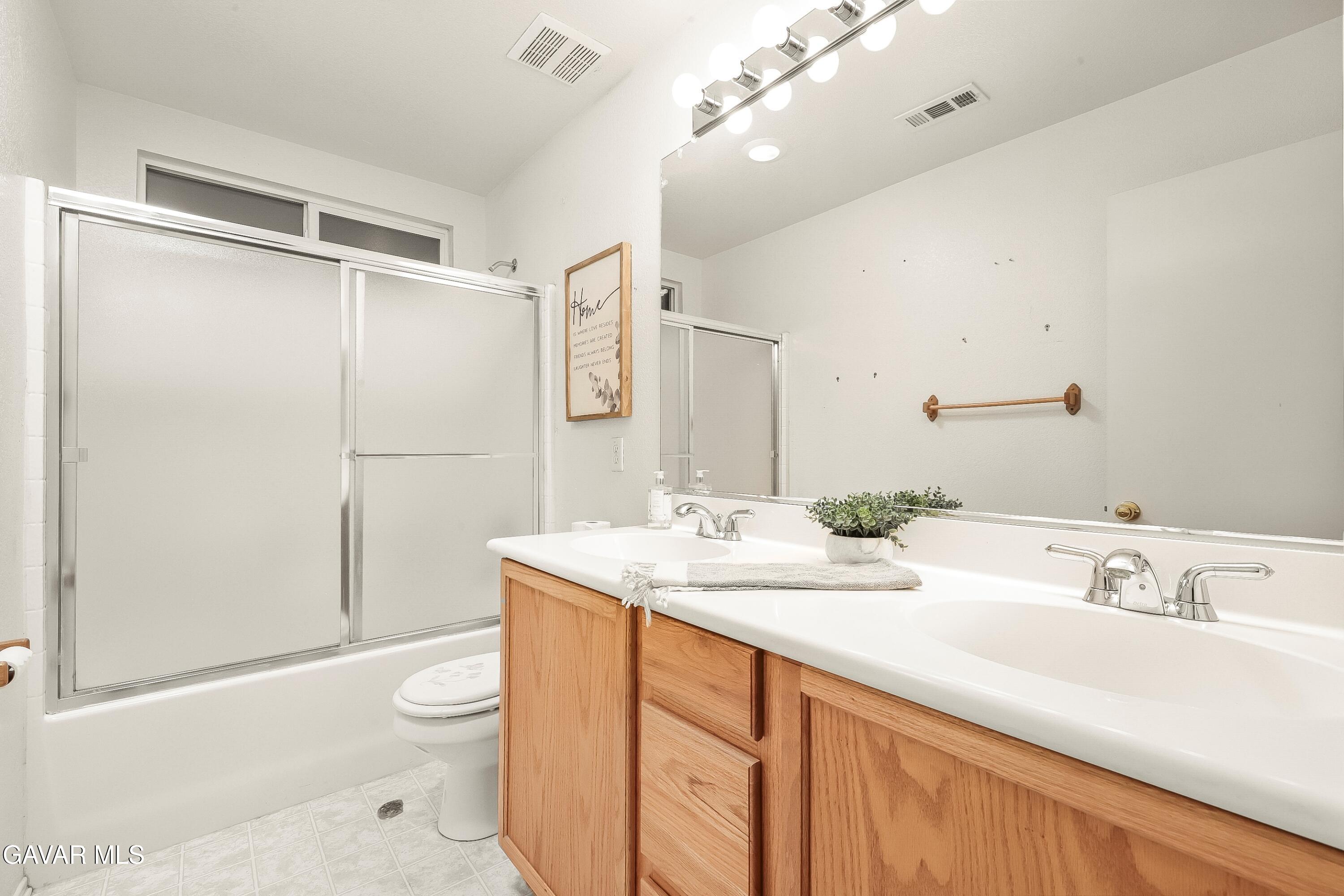 43635 Castle Circle Lancaster, CA 93535 - Photo 36 of 53 a bathroom with a sink toilet and shower