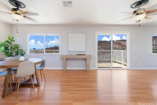 a living room with furniture a dining table and a fireplace