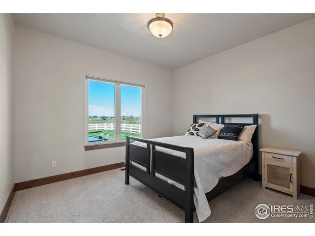 a bed room with a bed and a window