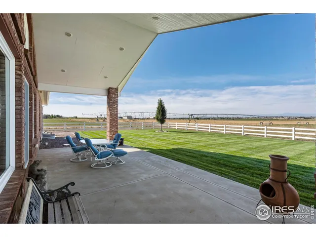 a view of a swimming pool and a yard