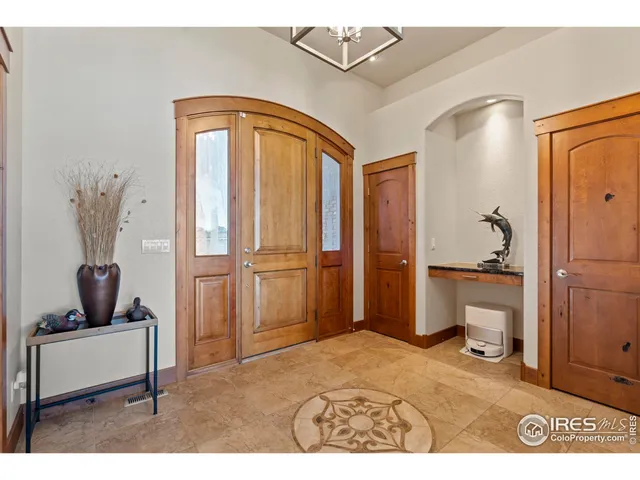 a living room with a furniture and a rug