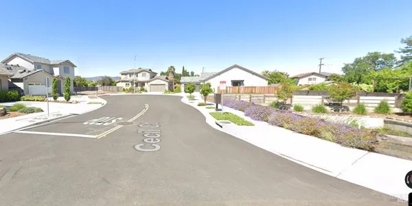a view of a street with a houses