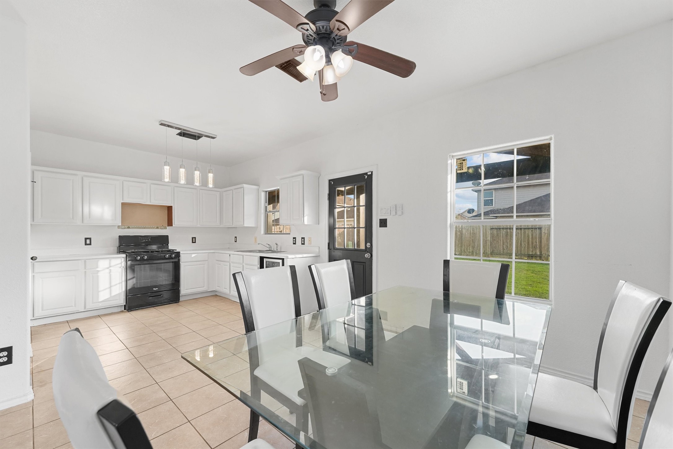 3114 Trinity Joe Lane Humble, TX 77396 - Photo 13 of 28 a view of a dining room with furniture window and wooden floor