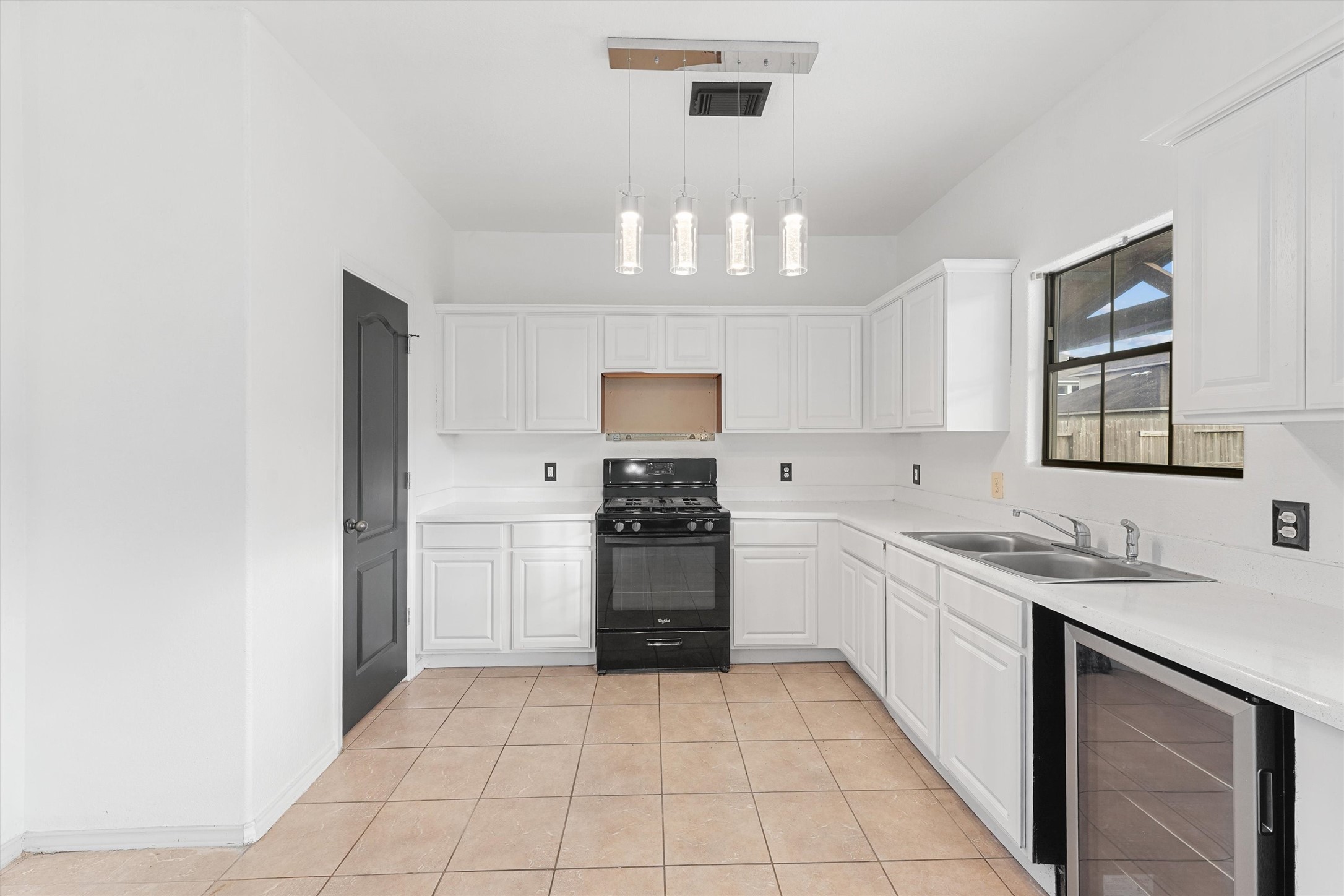 3114 Trinity Joe Lane Humble, TX 77396 - Photo 15 of 28 a kitchen with a stove sink and cabinets