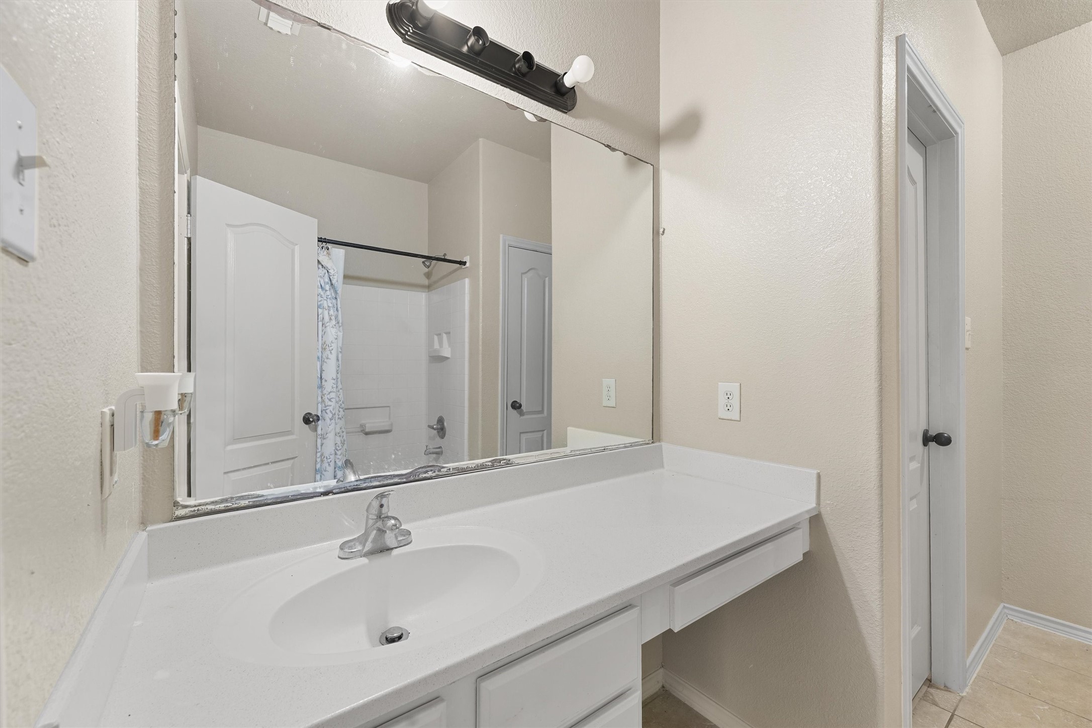3114 Trinity Joe Lane Humble, TX 77396 - Photo 17 of 28 a bathroom with a sink and a mirror