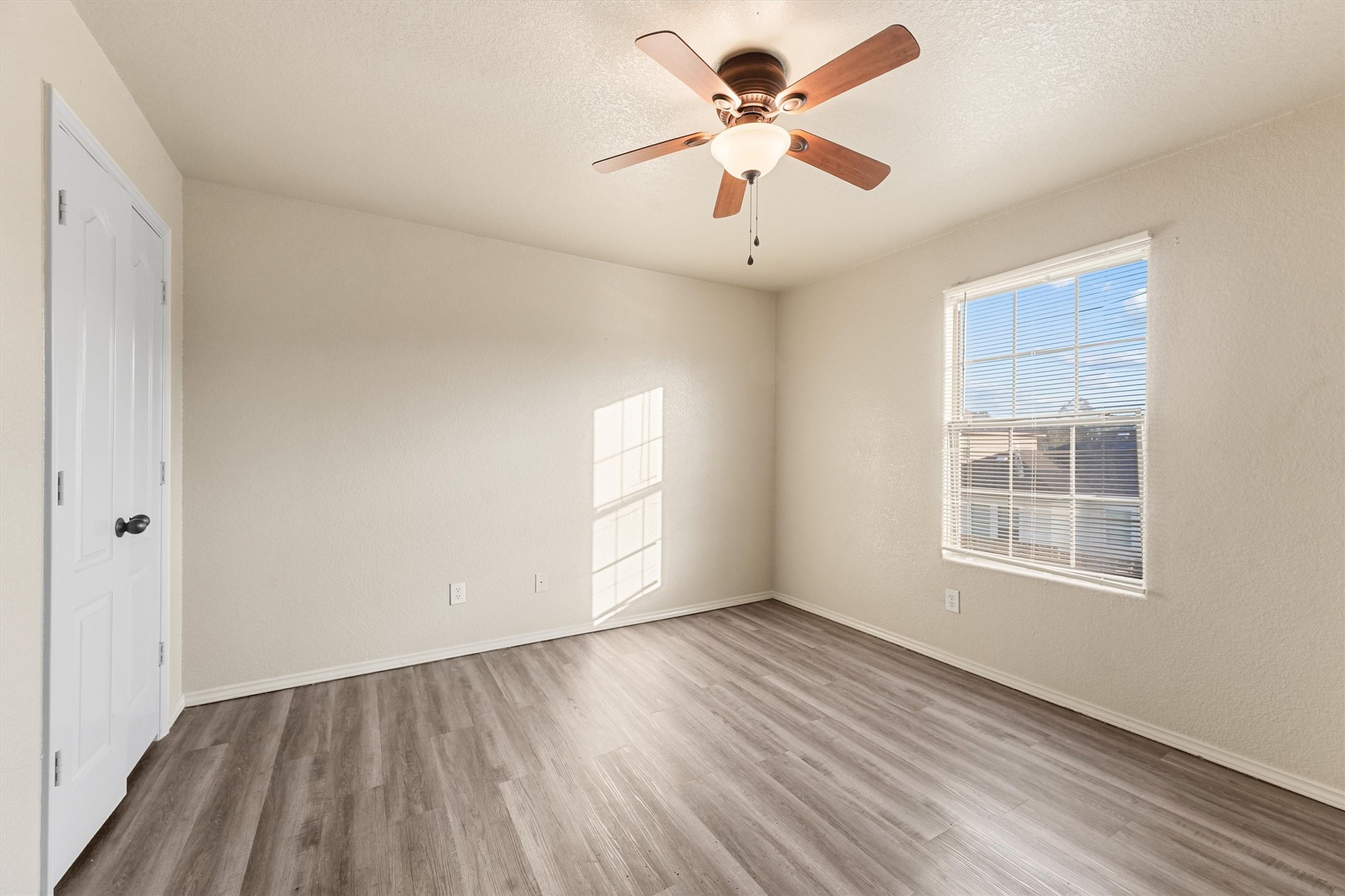 3114 Trinity Joe Lane Humble, TX 77396 - Photo 23 of 28 wooden floor in an empty room with a window