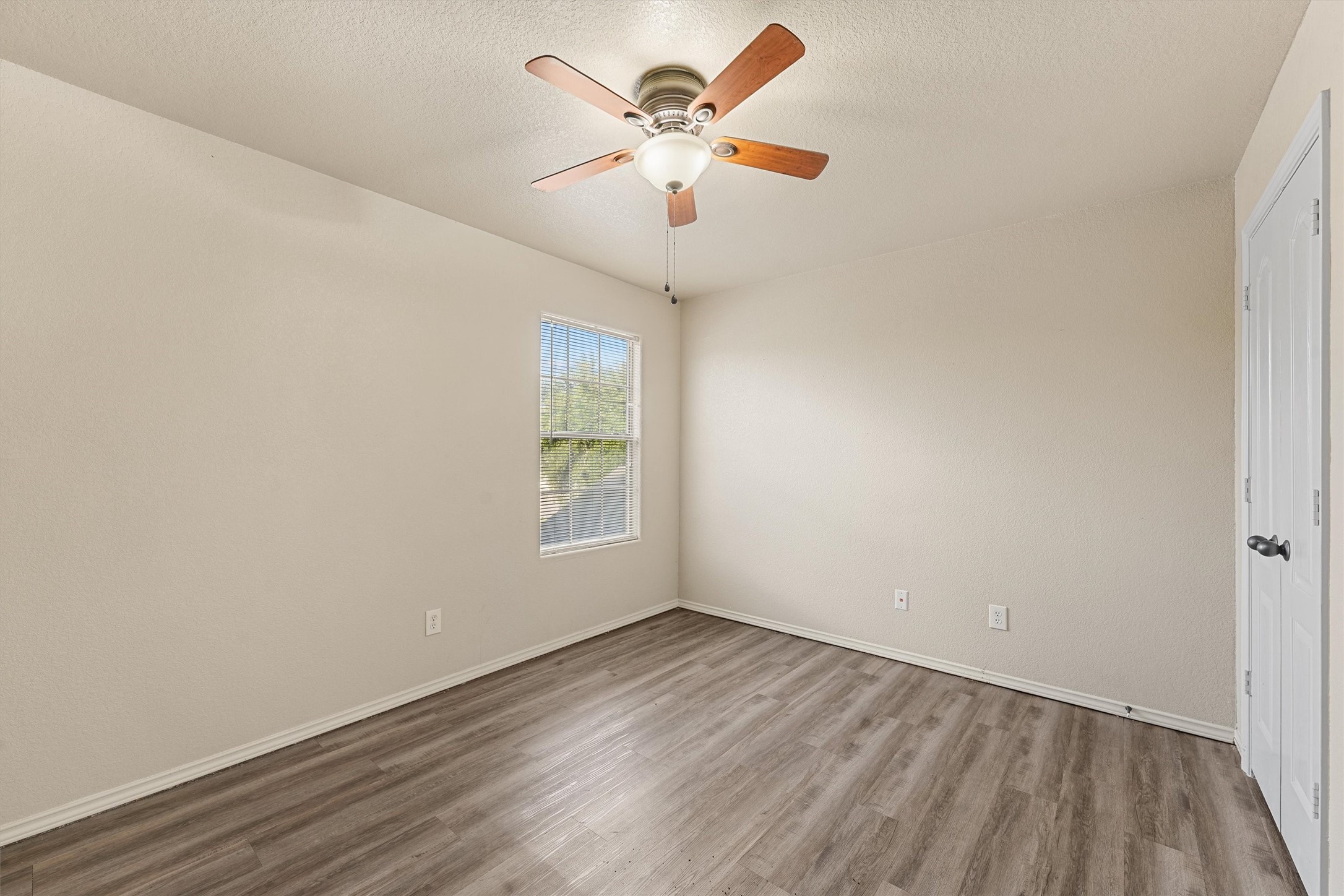 3114 Trinity Joe Lane Humble, TX 77396 - Photo 24 of 28 wooden floor in an empty room with a window