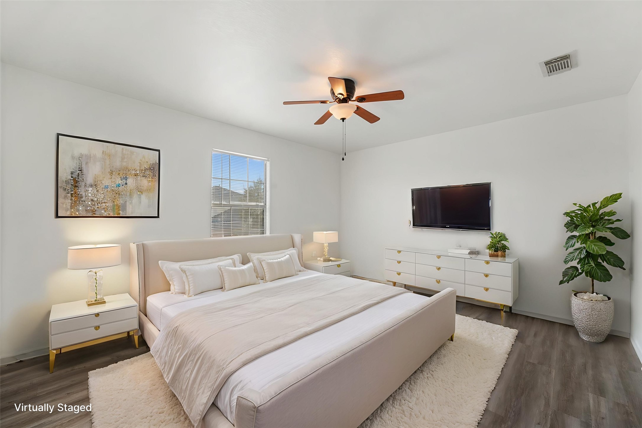 3114 Trinity Joe Lane Humble, TX 77396 - Photo 3 of 28 a bedroom with a large bed and a flat screen tv