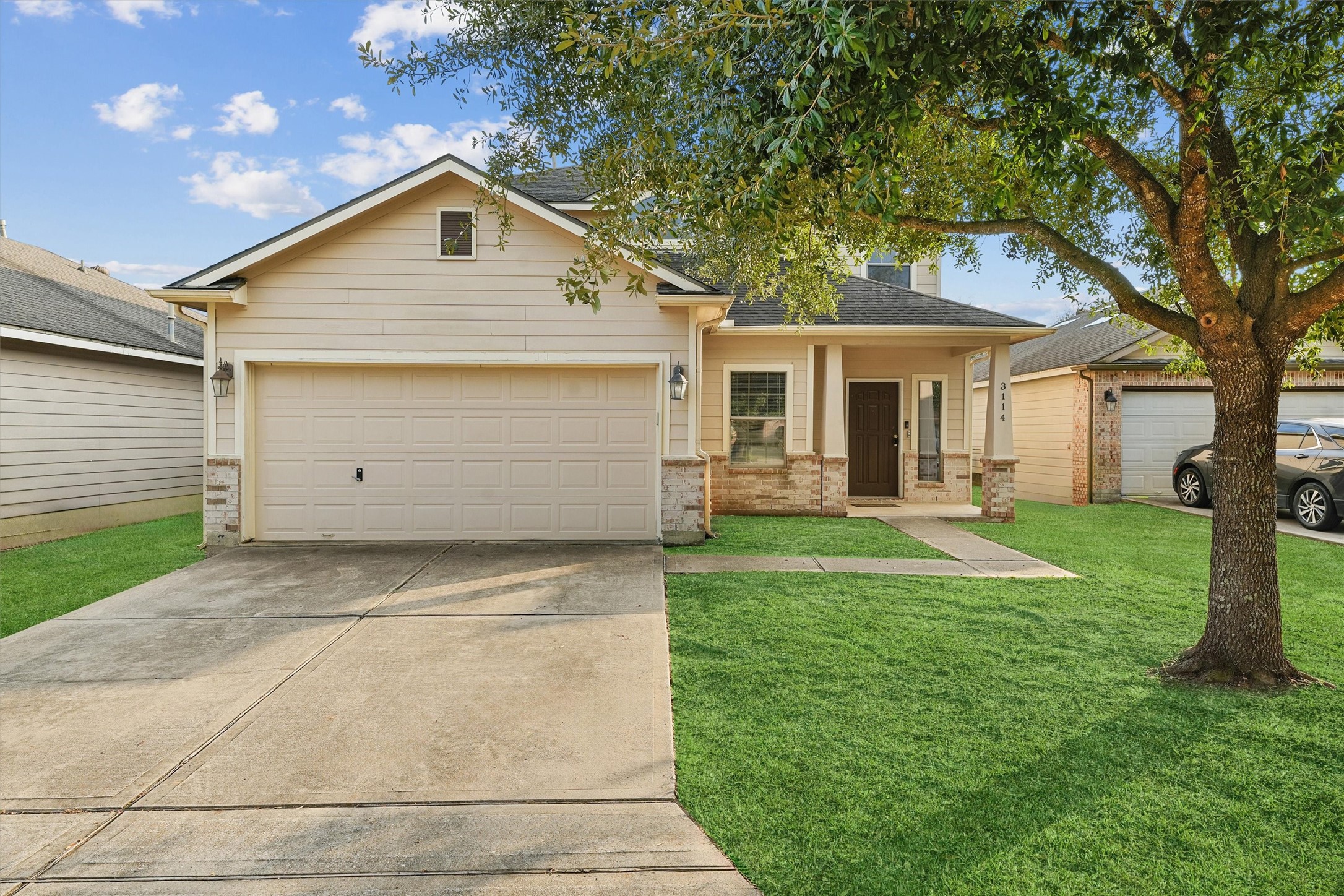 3114 Trinity Joe Lane Humble, TX 77396 - Photo 6 of 28 a front view of a house with a garden and yard