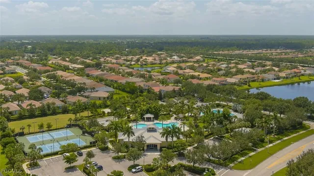 an aerial view of residential building and ocean