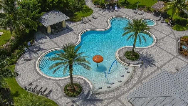 an aerial view of garden space with swimming pool and lounge chair