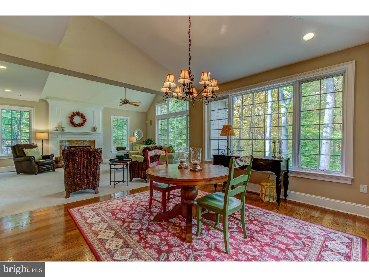 3316 Sawmill Road Newtown Square, PA 19073 - Photo 14 of 24 a dining room with furniture a rug and a chandelier